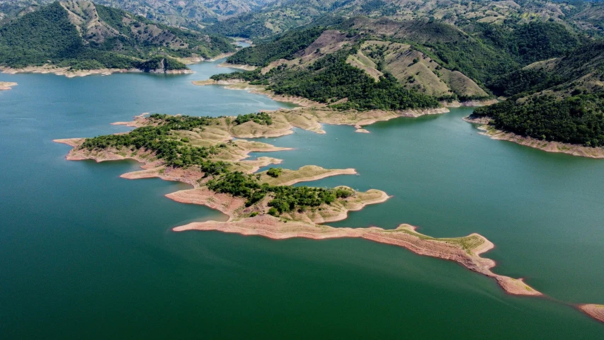 a large lake surrounded by mountains with lots of water