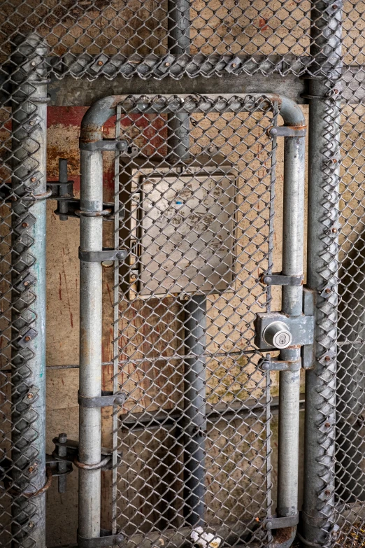 the gate between two pipters in an abandoned building