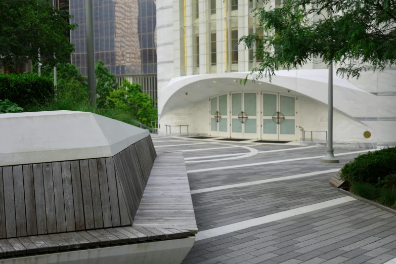 a building with a large white curved entrance