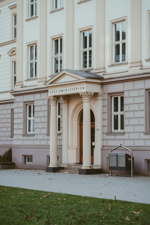 a building with an arch in front of it