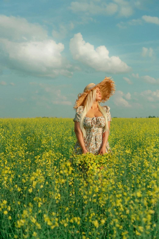 a woman in a field with flowers