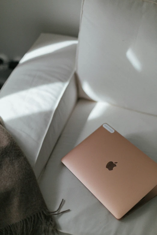 a laptop that is sitting on a bed