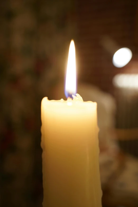 a candle that is burning and lightening up