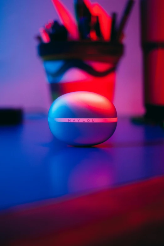 a colorful picture of a white ball sitting on top of a table