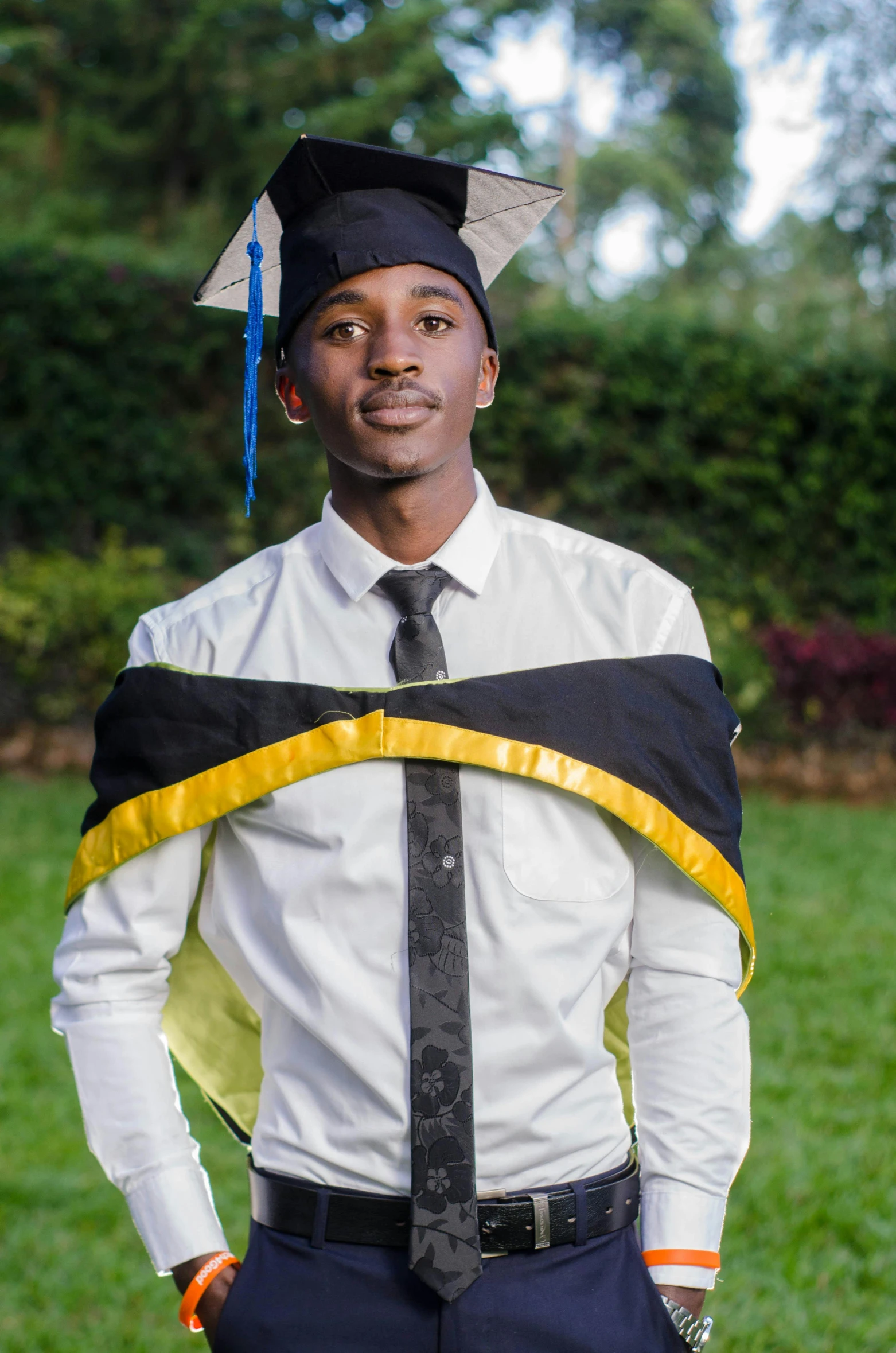 a man in a mortare and graduation gown