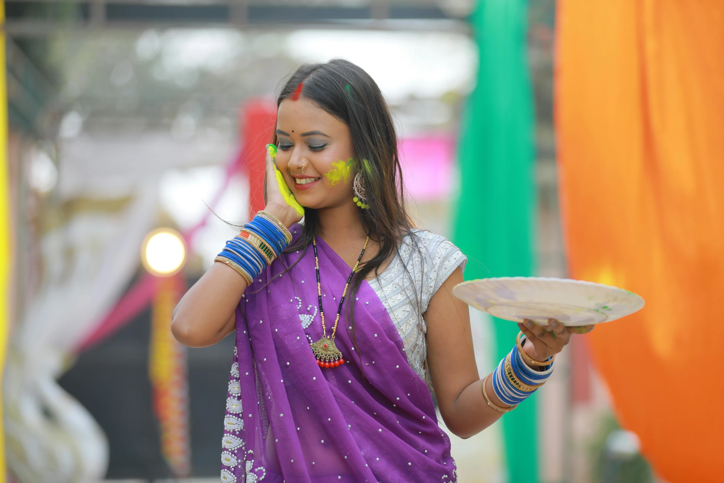 a woman in a sari talking on her cell phone