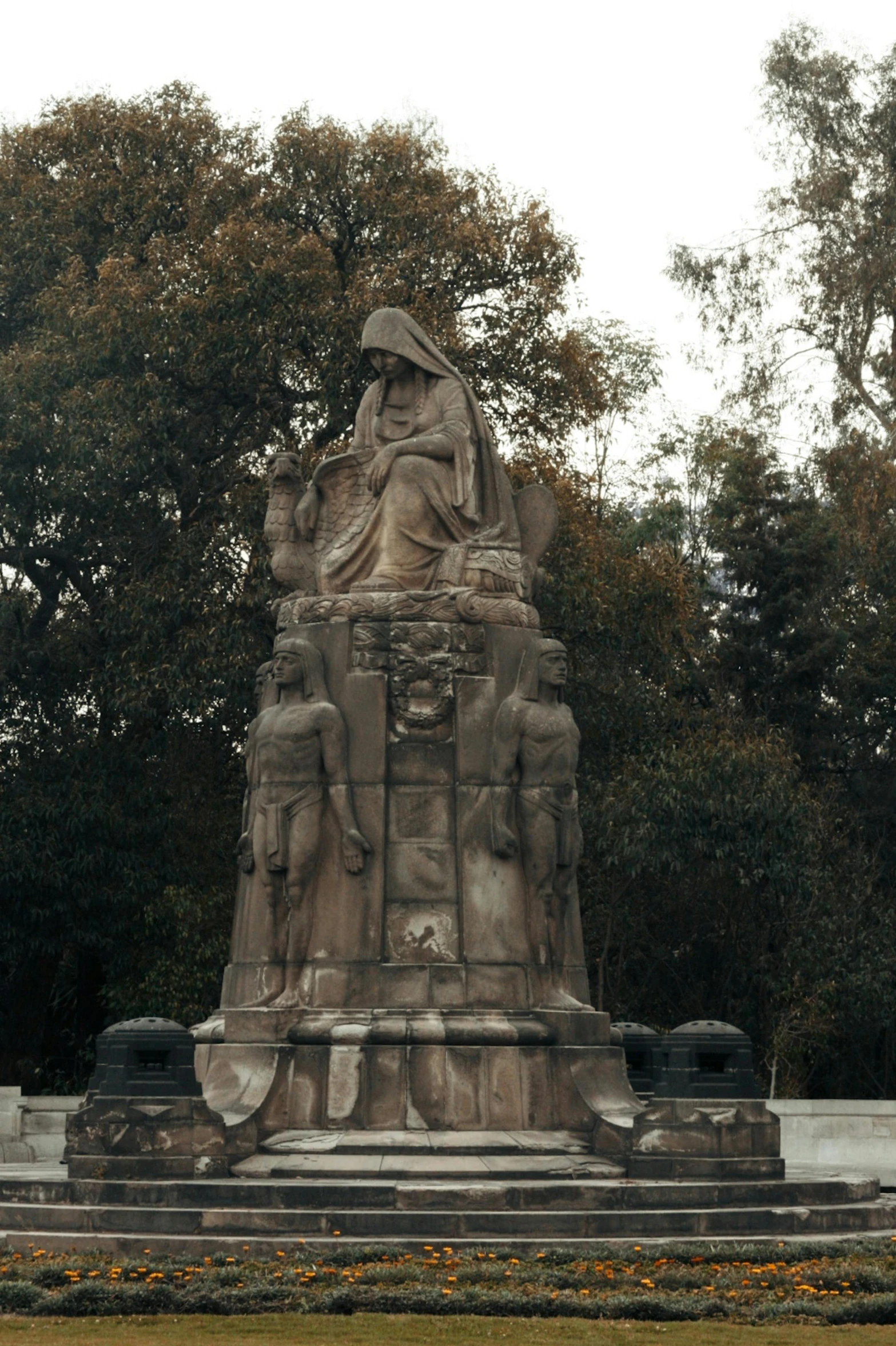 statue of a man and two other men