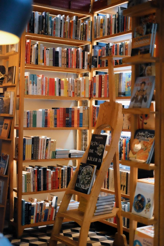 an empty liry with two chairs sitting next to the books