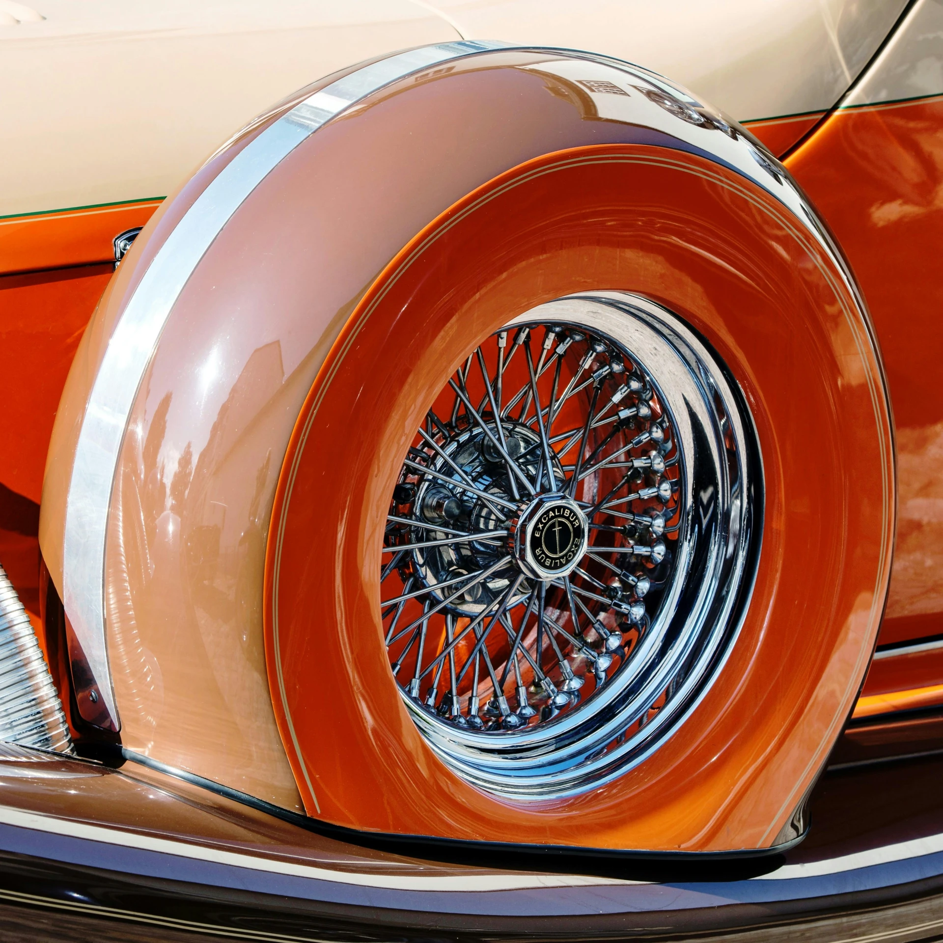 an old car with a large wheel on it