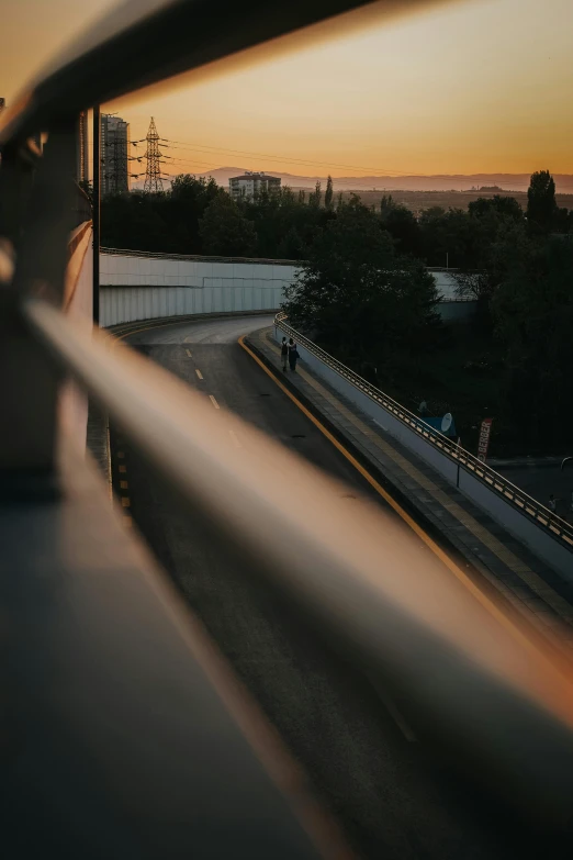 a view from a passenger car as it passes through a city