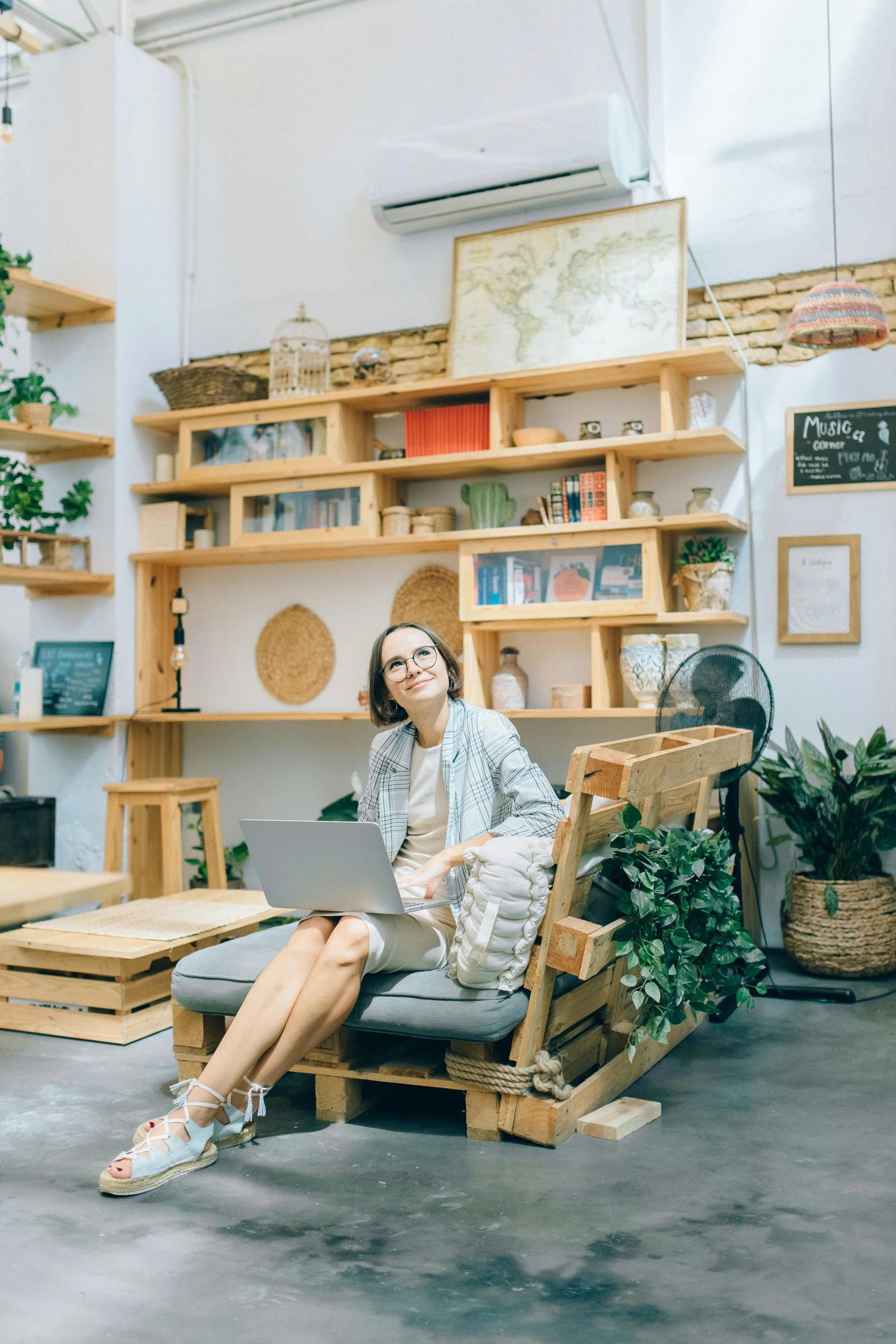 woman sitting on a chair using her laptop