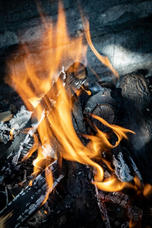 a large piece of wood burning brightly orange