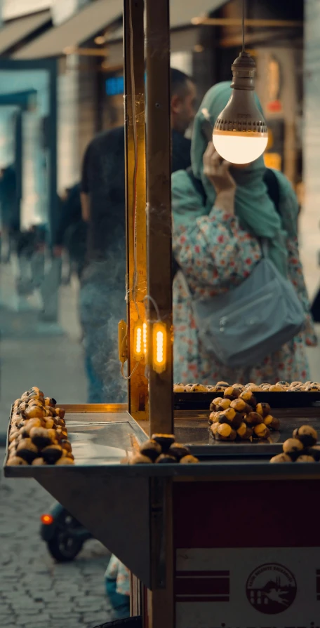 two women look at the street vendor