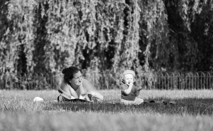 a girl is playing with a ball on the ground