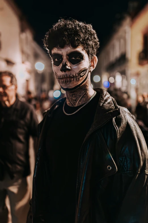 a man is dressed in sugar skull makeup