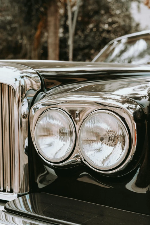 an old vintage black car headlight is pictured