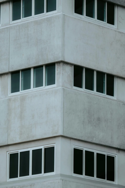 an old white building with small window frames