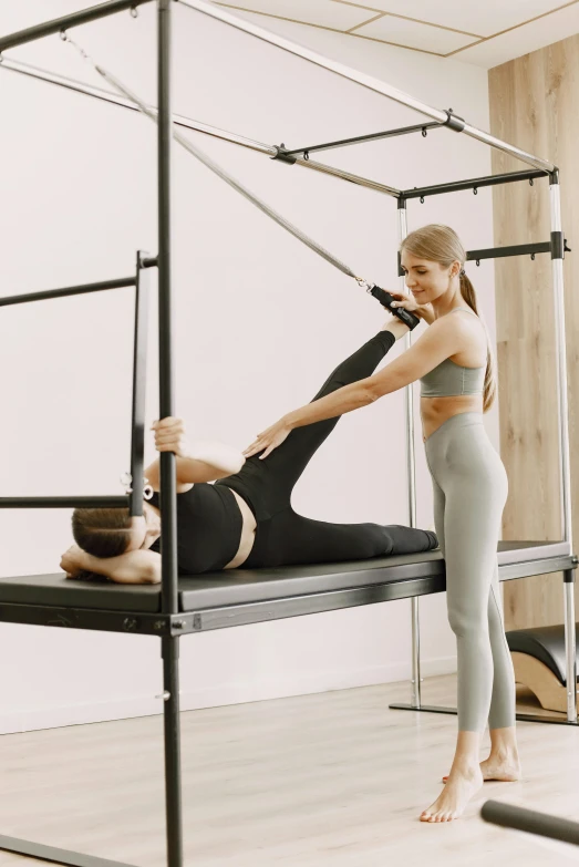 a woman doing a pisue exercise on the bed