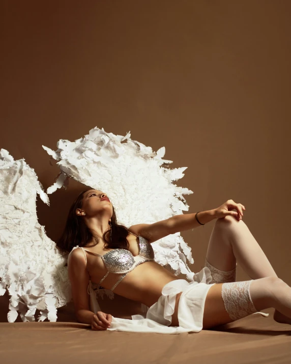 a  woman laying on top of a bed in underwear