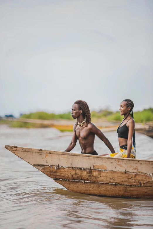 two women riding in a boat down the river