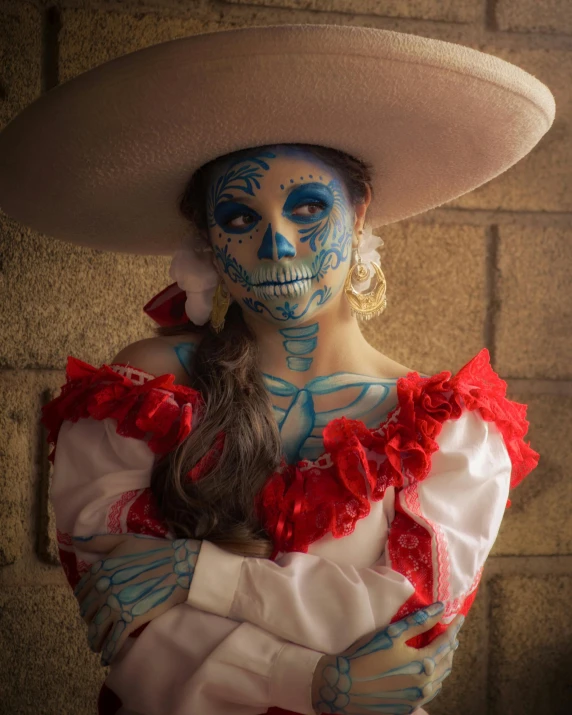 a woman in day of the dead makeup and costume