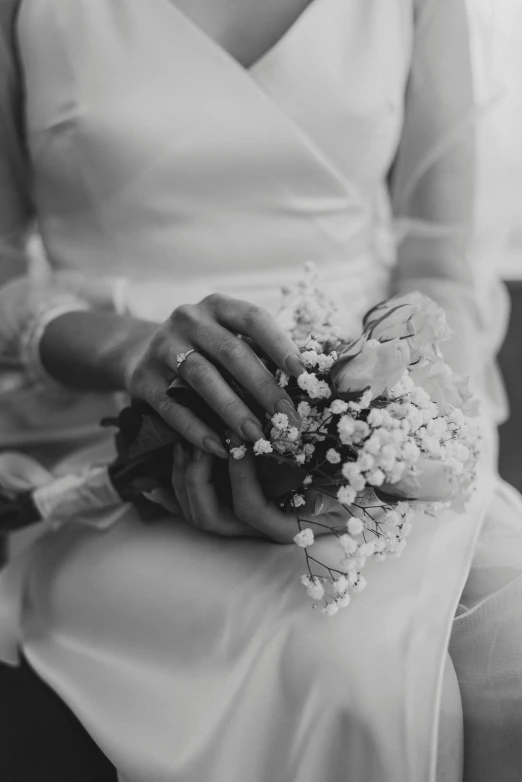 black and white pograph of woman wearing a wedding gown