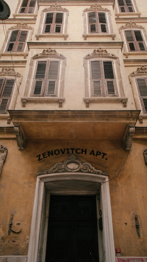 front entrance to a building with many windows