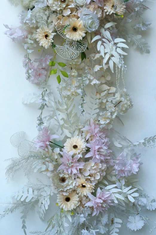 a group of flowers hanging up on a wall