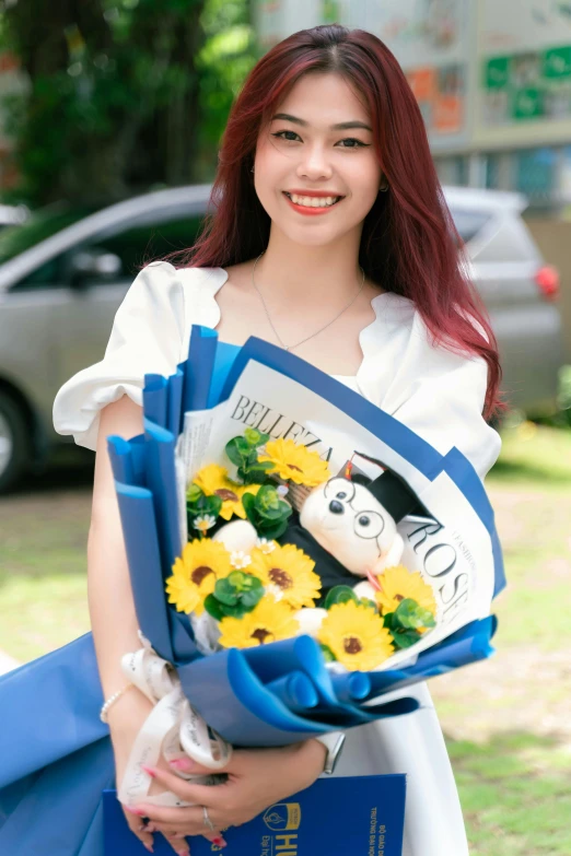 a girl holds a bouquet of flowers on her arm