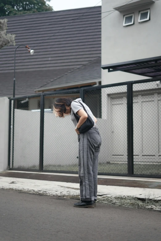 a girl on a street with a skateboard in hand