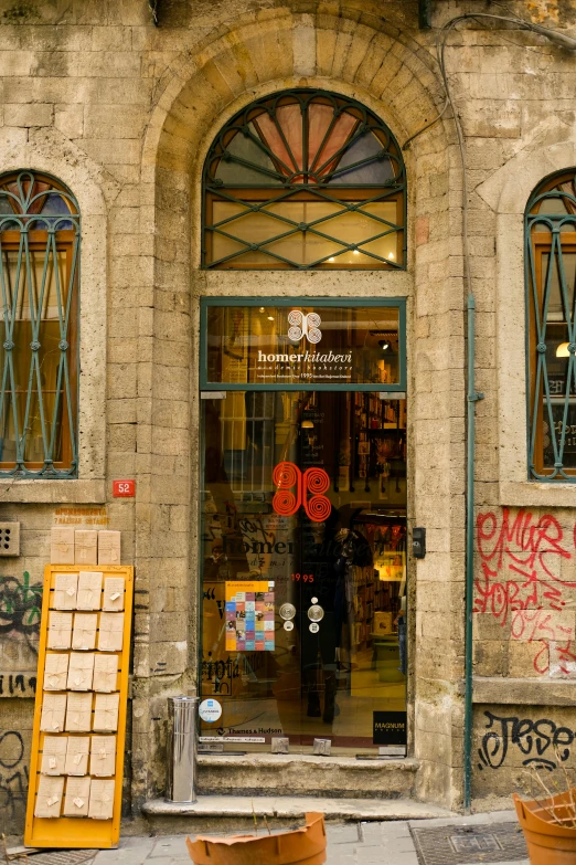 a storefront with large window displays an assortment of items