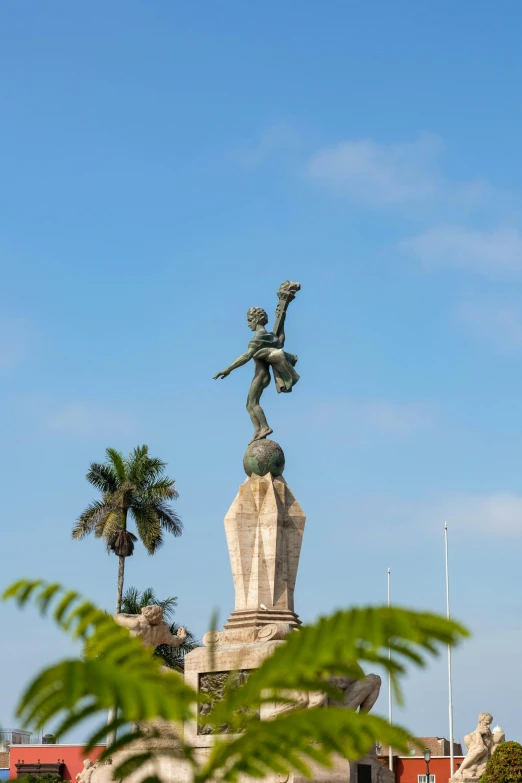 there is a statue on top of the hill