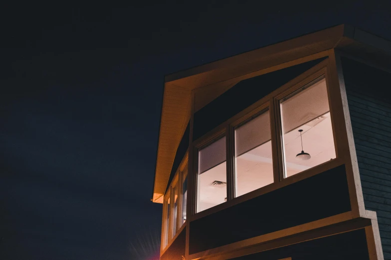 the window in the wooden building is lit up