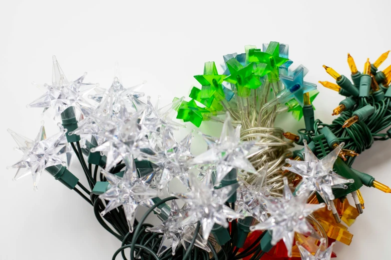 there is a bouquet of holiday lights and plastic wrapped flowers