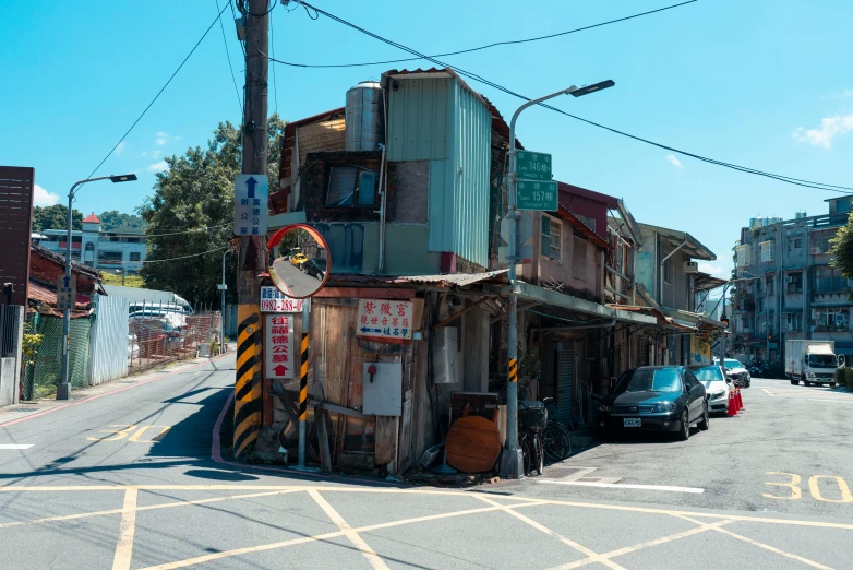 an old - fashioned gas station is near a highway