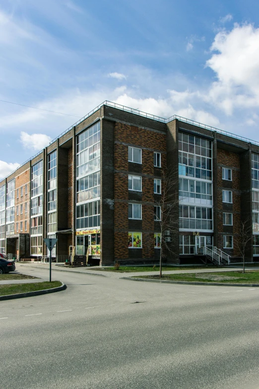 a large brick building with lots of windows on the outside of it