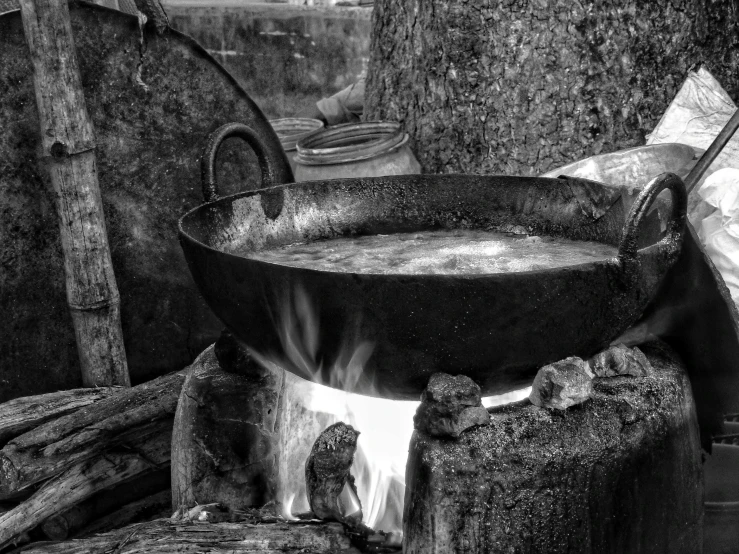 an old, antique cast iron pot is shown in black and white