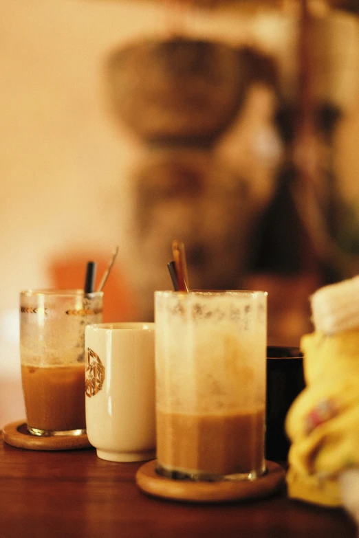 two empty cups are on a wooden table