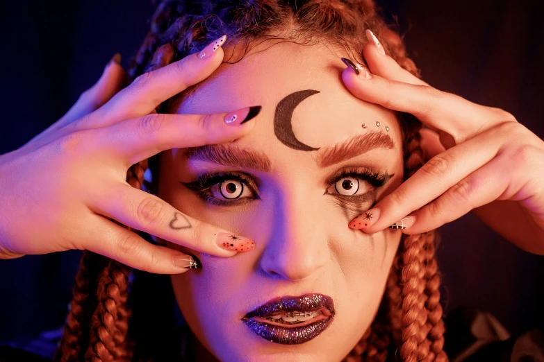 a woman with a crescent symbol painted on her face