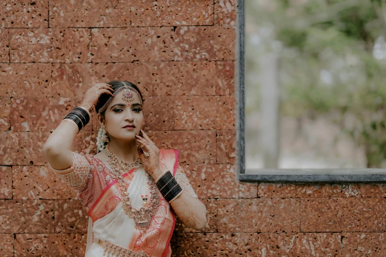 a woman in a bridal attire poses for a po