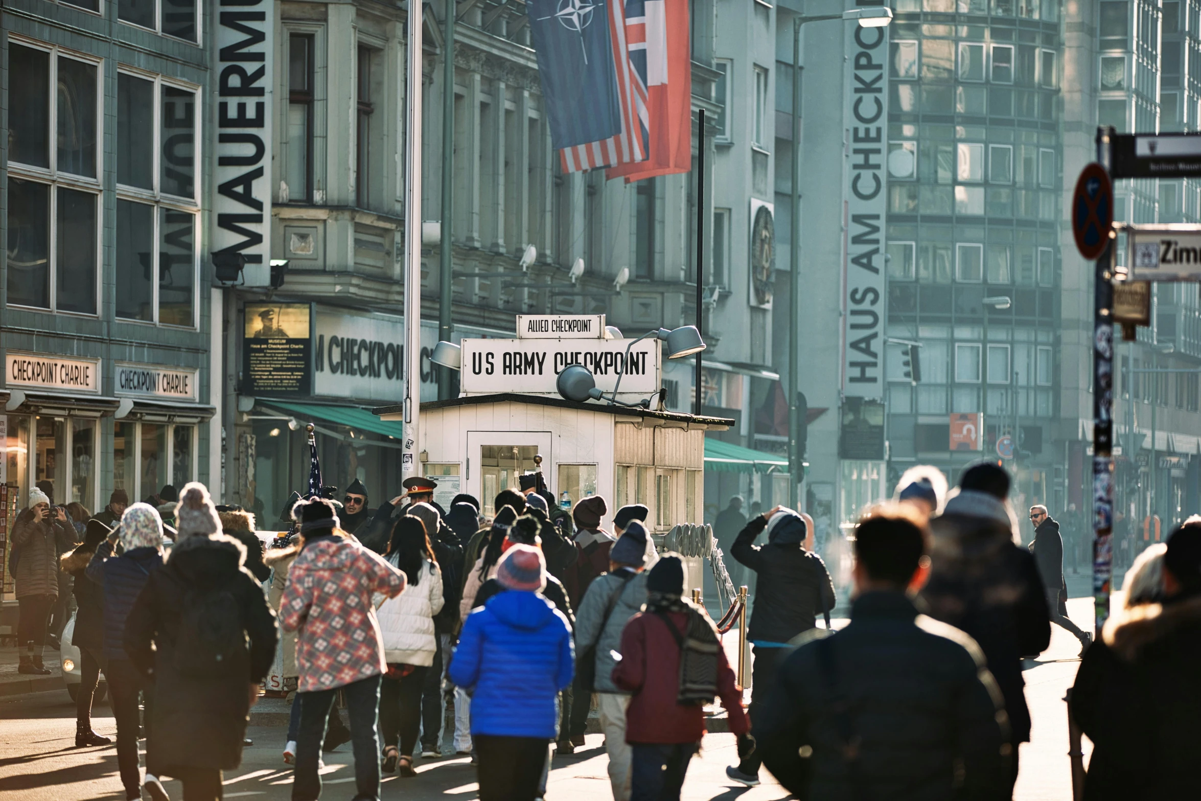 a bunch of people are walking down a street