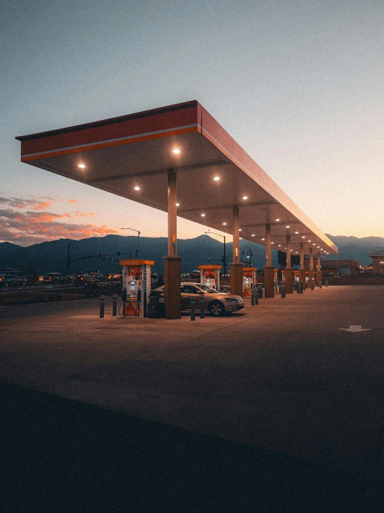 an empty gas station with no cars at dusk