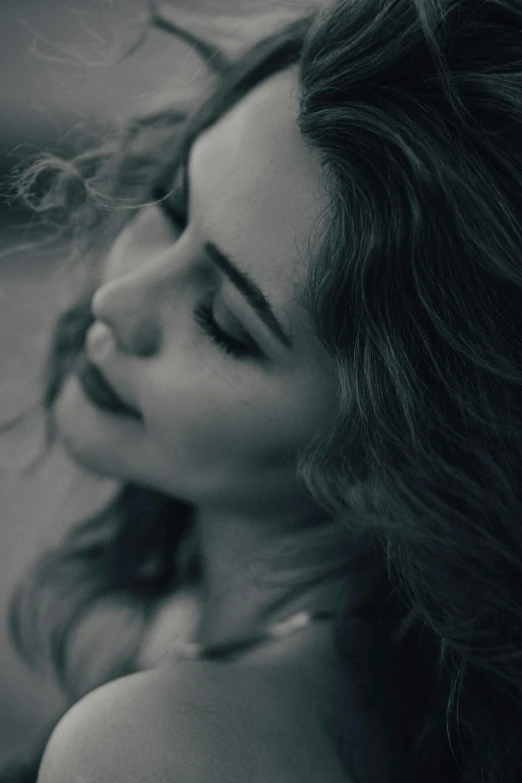 a woman posing with her hair in her hair