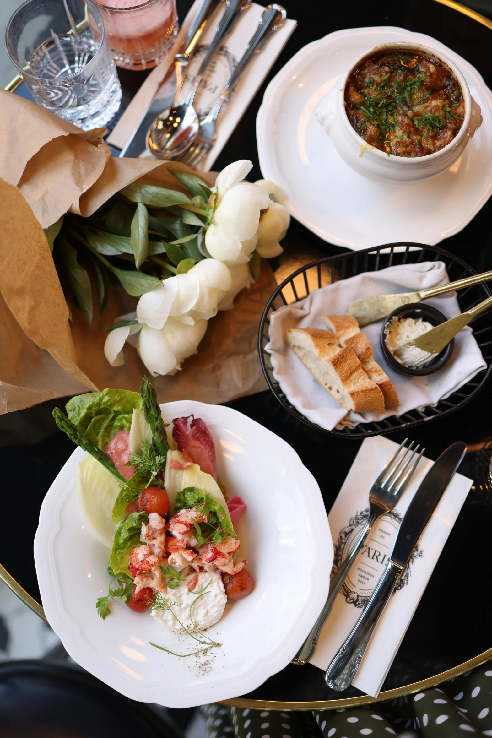 plates with food and drinks are on the table