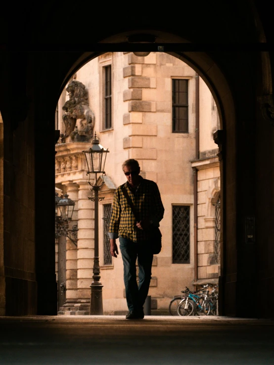 a man that is standing in the shade