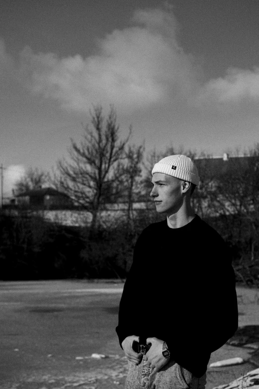 an older man with a baseball cap on in a parking lot