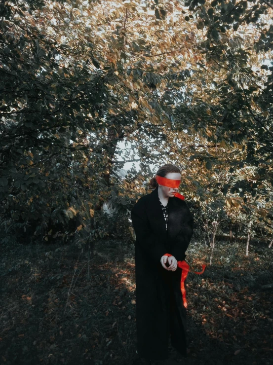 a nun holding a red bag in her hand