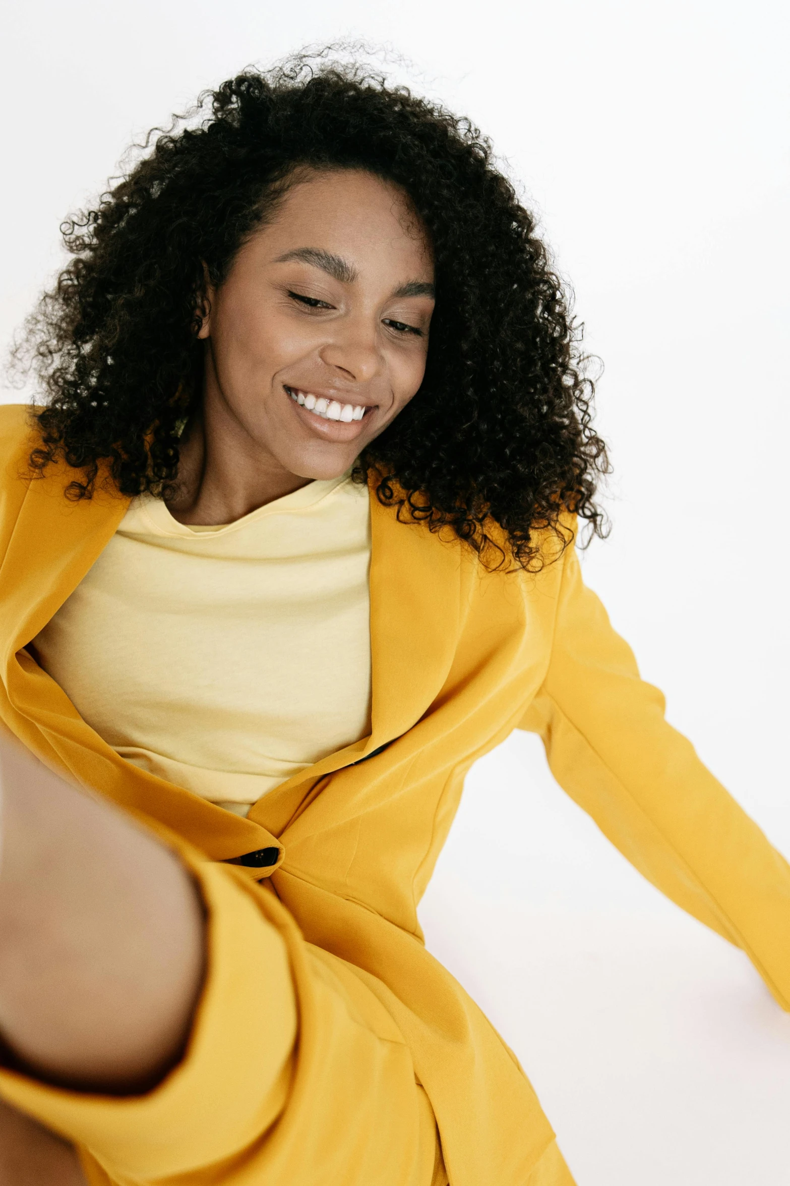 a young woman smiles as she poses for a pograph