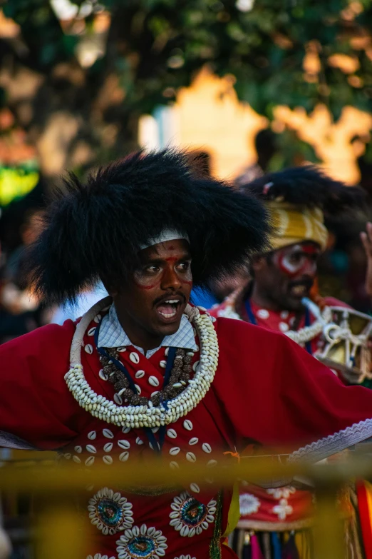 the man in costume is holding soing in his hand