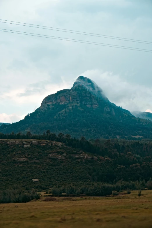 a mountain top and a valley below it